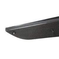 Close-up of Corvette C8 carbon fiber side skirt showing weave pattern and surface finish
