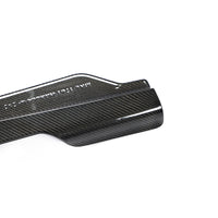 Close-up of Corvette C8 carbon fiber side skirt showing weave pattern and surface finish
