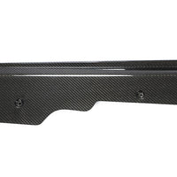 Close-up of Corvette C8 carbon fiber side skirt showing weave pattern and surface finish
