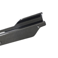 Close-up of Corvette C8 carbon fiber side skirt showing weave pattern and surface finish
