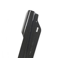 Close-up of Corvette C8 carbon fiber side skirt showing weave pattern and surface finish
