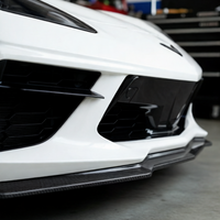 Corvette C8 Z06 with VASL carbon fiber front splitter, low-angle shot showing aerodynamic profile and carbon fiber texture in natural environment