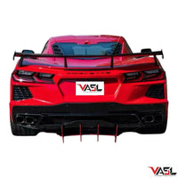 Corvette C8 Z51 equipped with VASL carbon fiber high wing spoiler, full rear three-quarter view in cinematic outdoor setting