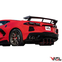 Corvette C8 Z51 equipped with VASL carbon fiber high wing spoiler, full rear three-quarter view in cinematic outdoor setting