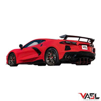 Corvette C8 Z51 equipped with VASL carbon fiber high wing spoiler, full rear three-quarter view in cinematic outdoor setting