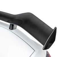 Detailed close-up of VASL carbon fiber rear spoiler on Corvette C8 Z06, showing 3D weave texture and mounting points