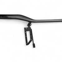 Detailed close-up of VASL carbon fiber rear spoiler on Corvette C8 Z06, showing 3D weave texture and mounting points
