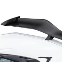 Detailed close-up of VASL carbon fiber rear spoiler on Corvette C8 Z06, showing 3D weave texture and mounting points