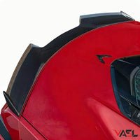 Close-up of VASL carbon fiber rear spoiler installed on a Corvette C8 Z06, showing precise fitment, carbon fiber weave, and aerodynamic curvature