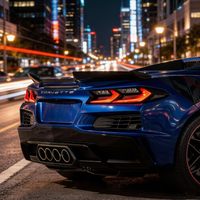 Real-world installation of VASL carbon fiber rear spoiler on a blue Corvette C8 Z06, showing integrated OEM 5V5 style and aggressive rear appearance