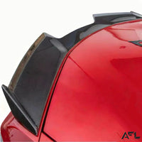 Close-up of VASL carbon fiber rear spoiler installed on a Corvette C8 Z06, showing precise fitment, carbon fiber weave, and aerodynamic curvature